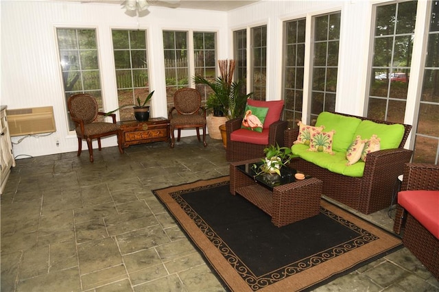 9130 Charlton Pl, Douglasville, GA 30135 - sunroom with stone finish flooring, outdoor lounge area, ceiling fan, and an AC wall unit