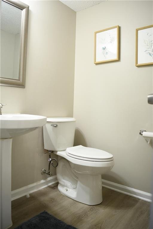 9130 Charlton Pl, Douglasville, GA 30135 - half bath featuring wood finished floors and a textured ceiling