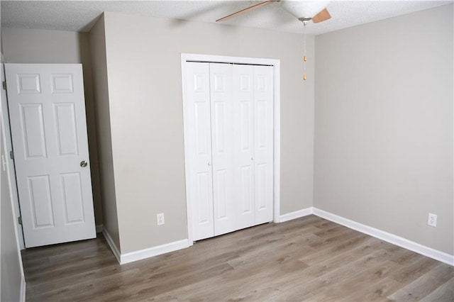 9130 Charlton Pl, Douglasville, GA 30135 - unfurnished bedroom featuring wood finished floors, a closet, and ceiling fan