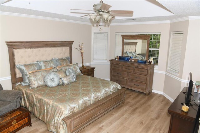 9130 Charlton Pl, Douglasville, GA 30135 - bedroom featuring wood finished floors, ornamental molding, french doors, and a ceiling fan
