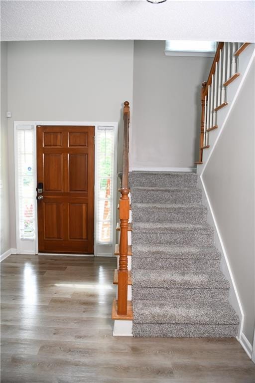 9130 Charlton Pl, Douglasville, GA 30135 - foyer entrance with stairs and wood finished floors