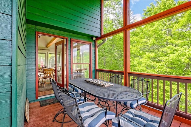 sunroom / solarium with outdoor dining space