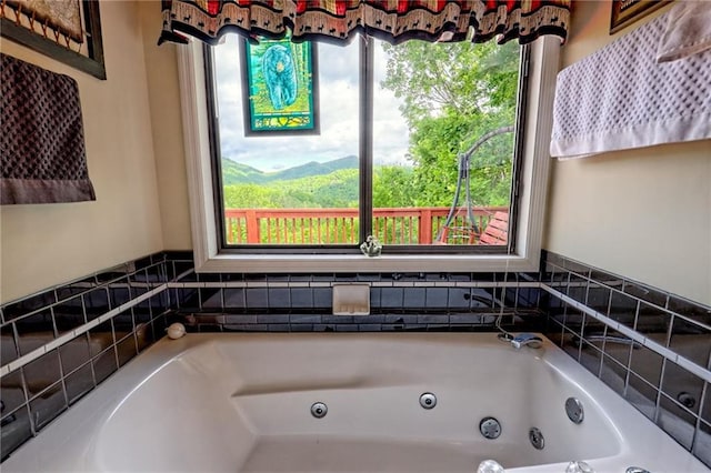 full bathroom featuring a whirlpool tub