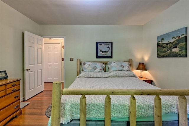 bedroom featuring wood finished floors
