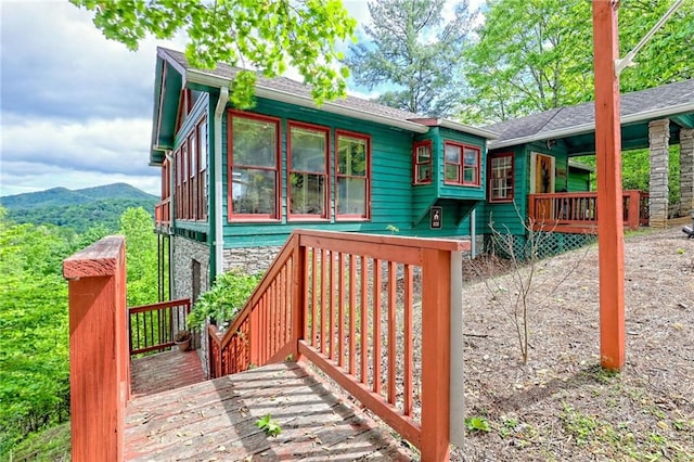 wooden deck featuring a mountain view