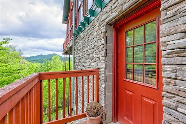 entrance to property featuring stone siding