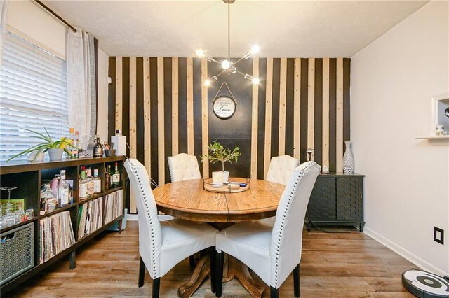 dining room featuring a chandelier and light wood-type flooring