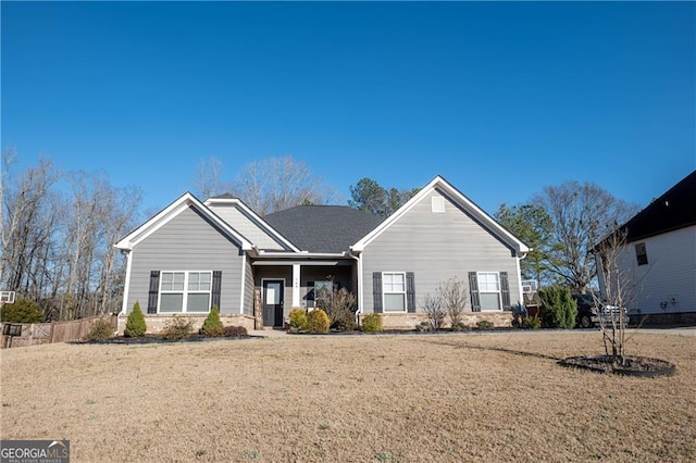 ranch-style home with a front yard