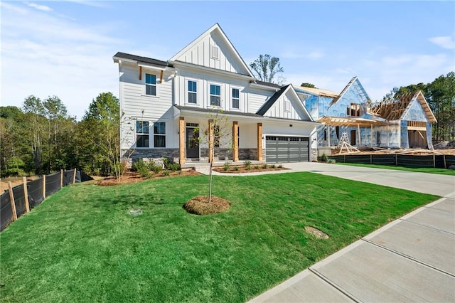 view of front of house featuring a garage and a front yard