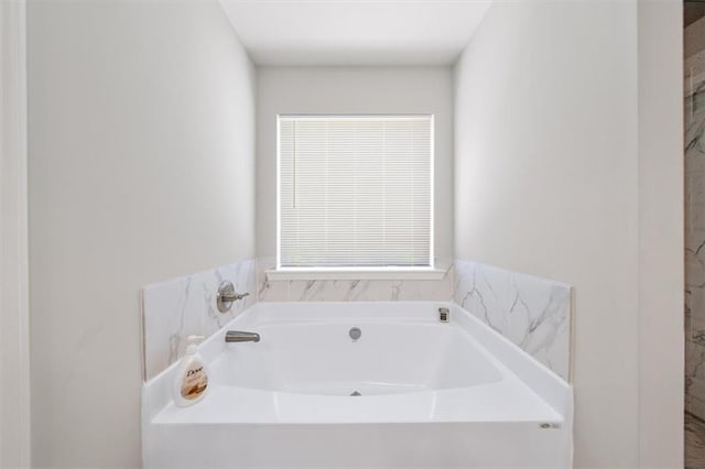 full bathroom with a bath