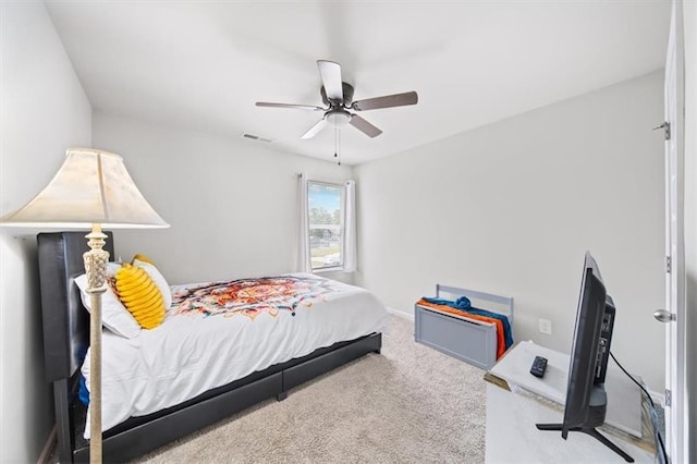 carpeted bedroom with ceiling fan