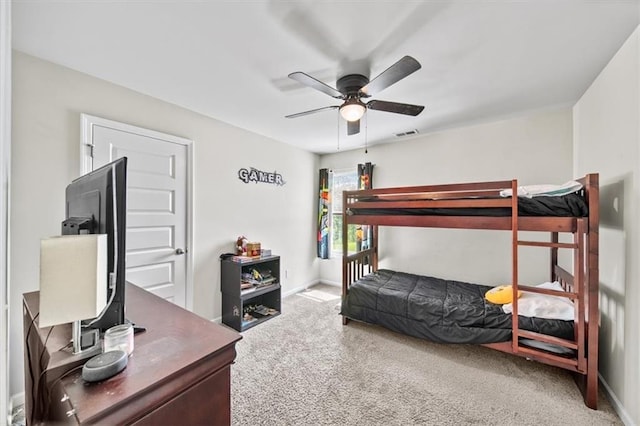bedroom with carpet, baseboards, and ceiling fan