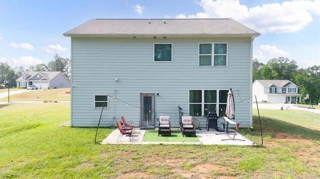 back of house with a patio and a lawn