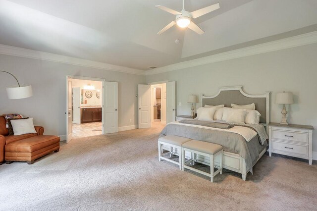 bedroom featuring crown molding, connected bathroom, baseboards, and light carpet