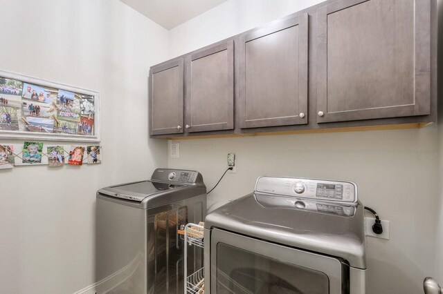 laundry room featuring cabinet space and independent washer and dryer