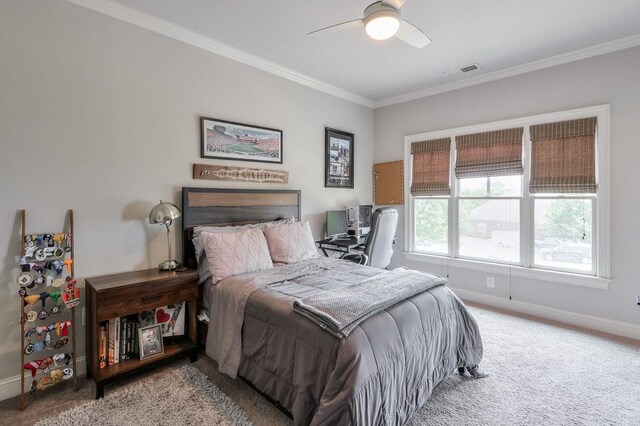 bedroom featuring visible vents, ornamental molding, light carpet, baseboards, and a ceiling fan