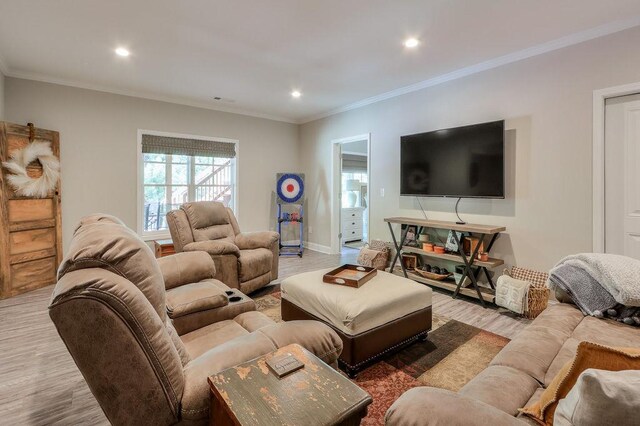 living area with crown molding, recessed lighting, baseboards, and wood finished floors