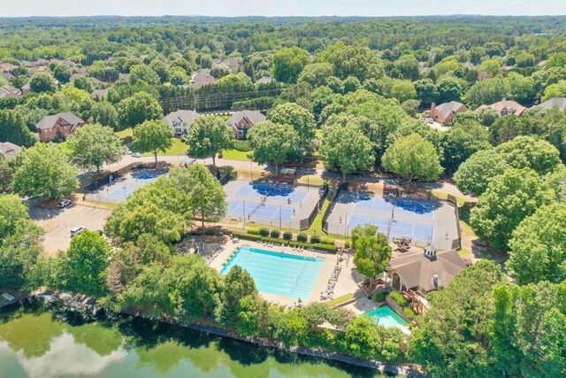 birds eye view of property with a forest view