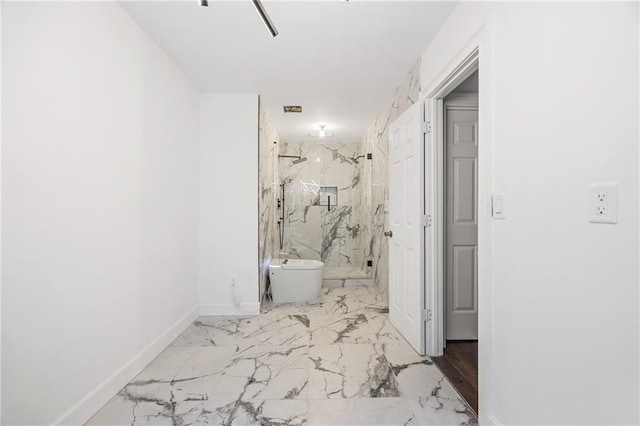 bathroom with toilet, marble finish floor, a marble finish shower, and baseboards