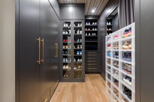 wine area with light wood-style floors and recessed lighting