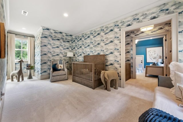 bedroom with carpet and wallpapered walls