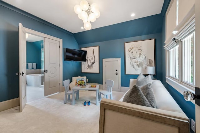 carpeted office space featuring a chandelier, baseboards, and lofted ceiling