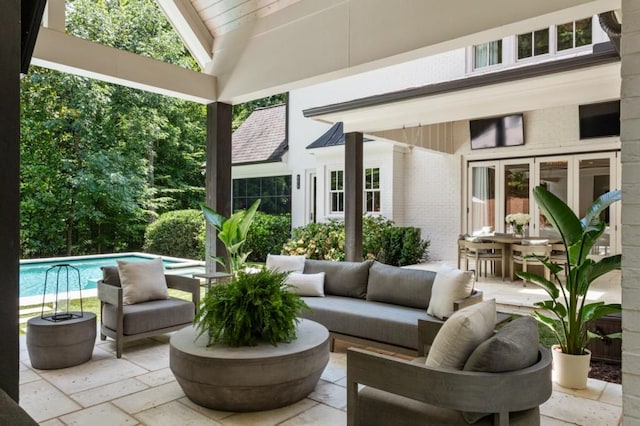 view of patio / terrace featuring outdoor lounge area and an outdoor pool