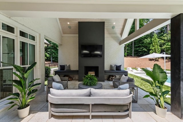 view of patio / terrace featuring an outdoor living space with a fireplace