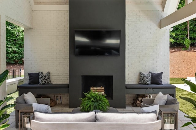 view of patio / terrace featuring an outdoor living space with a fireplace