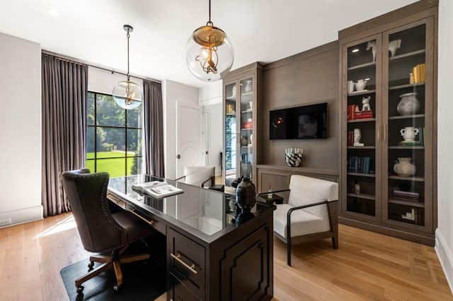 office area with light wood-style flooring