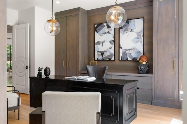 office space with light wood-type flooring and recessed lighting