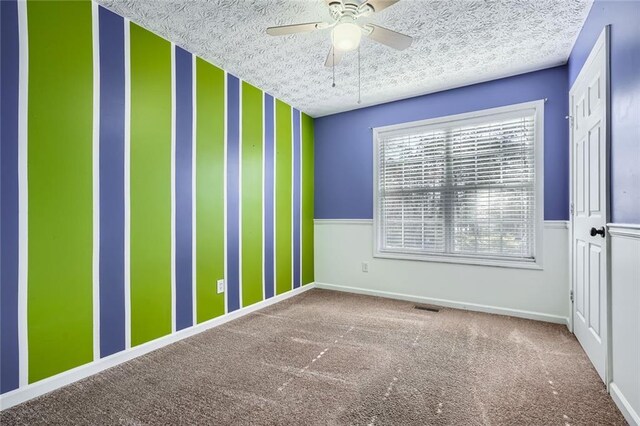 full bathroom featuring vanity, a textured ceiling,  shower combination, tile patterned floors, and toilet