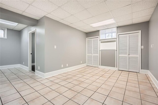 bathroom with a textured ceiling, tile patterned flooring, vanity, and toilet