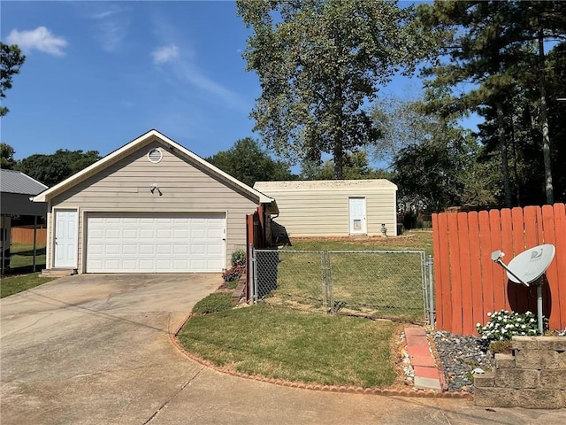 garage featuring a lawn