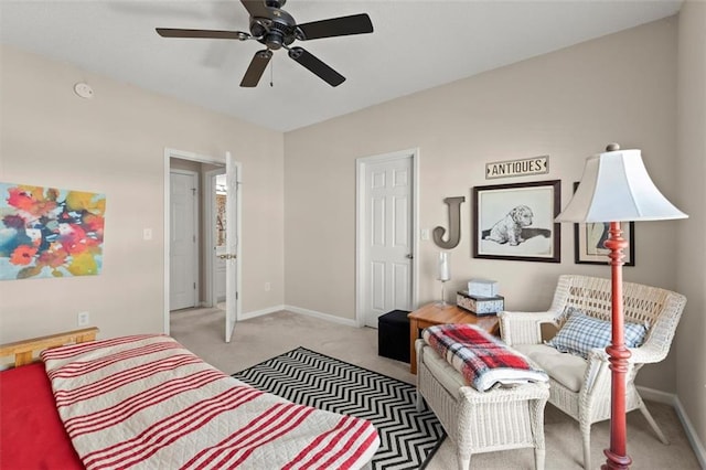 bedroom featuring baseboards and light carpet