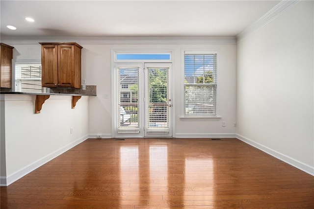 1935 Cobblestone Cir NE, Brookhaven, GA 30319 - unfurnished dining area with ornamental molding, dark wood finished floors, and recessed lighting
