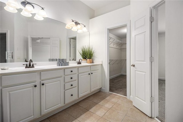 1935 Cobblestone Cir NE, Brookhaven, GA 30319 - full bath featuring double vanity, a walk in closet, and tile patterned flooring