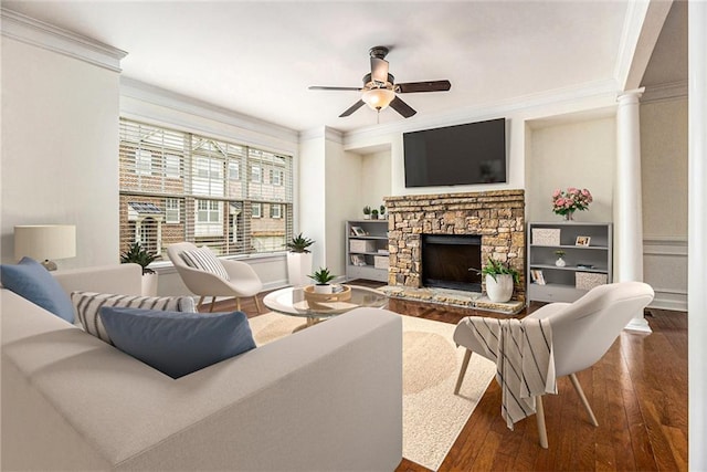 1935 Cobblestone Cir NE, Brookhaven, GA 30319 - living room featuring crown molding, ceiling fan, wood-type flooring, a stone fireplace, and ornate columns
