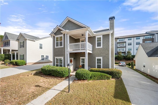 view of front of home featuring a balcony