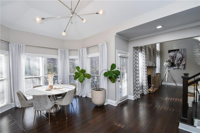 dining space featuring dark hardwood / wood-style flooring and a chandelier