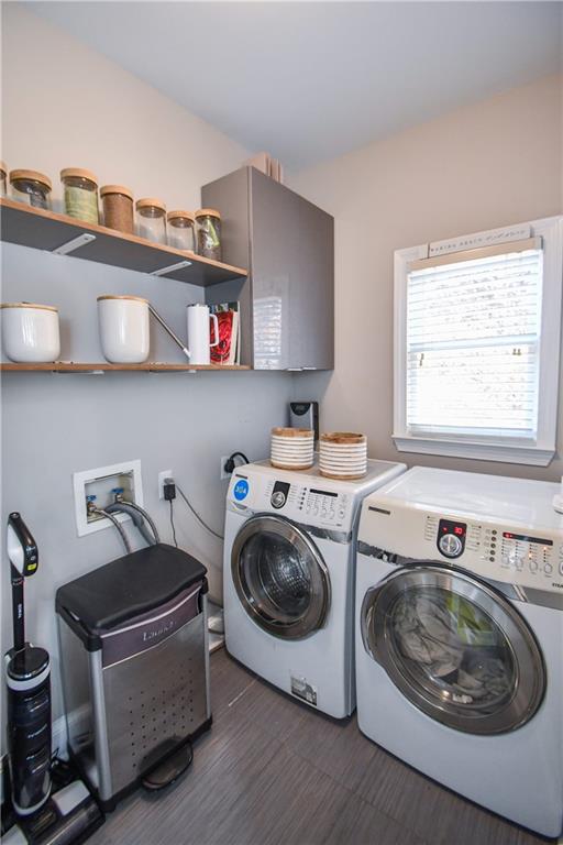 clothes washing area featuring washing machine and clothes dryer