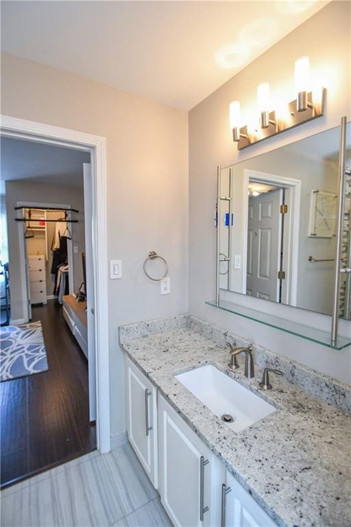 bathroom featuring hardwood / wood-style floors and vanity