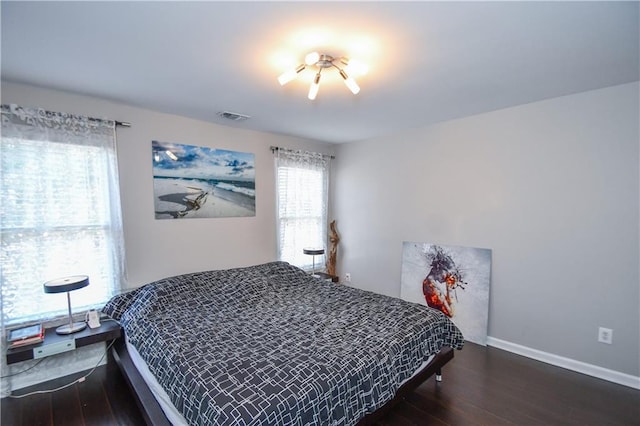 bedroom featuring dark hardwood / wood-style flooring