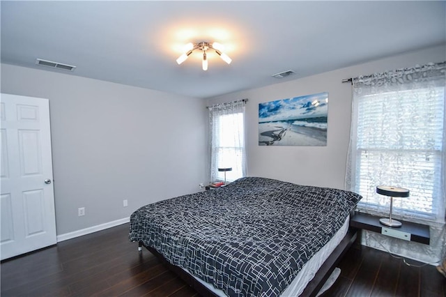 bedroom featuring dark hardwood / wood-style floors