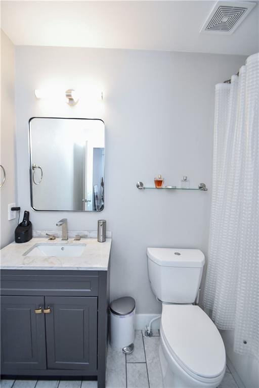 full bathroom with toilet, vanity, tile patterned floors, and shower / tub combo with curtain