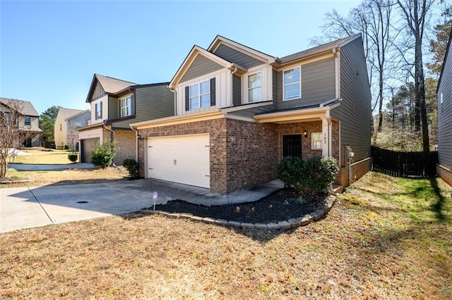 view of front of home with a garage, concrete driveway, brick siding, and fence