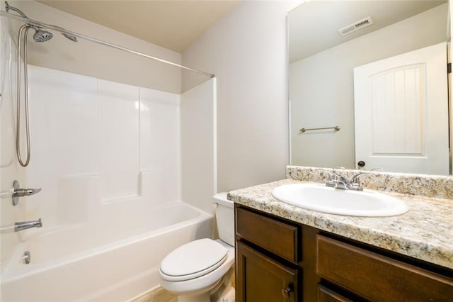 bathroom with toilet, bathing tub / shower combination, vanity, and visible vents