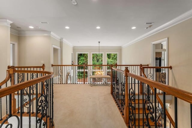 hallway with carpet flooring and ornamental molding