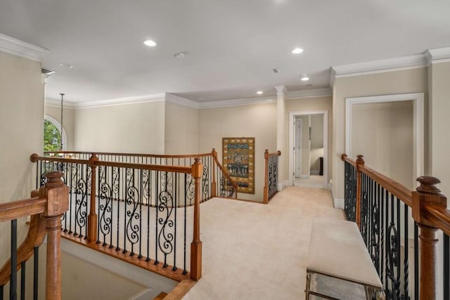 corridor featuring light carpet, ornamental molding, and a notable chandelier