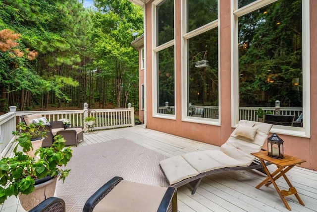 wooden terrace featuring outdoor lounge area